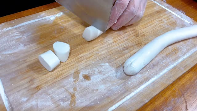 Pour water into the flour and instantly turn it into a football delicacy