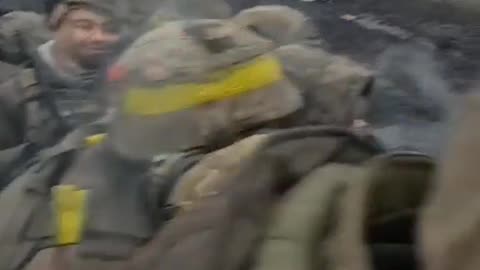 A group of Ukrainian servicemen pass by a broken AFU column in the Bakhmut direction.