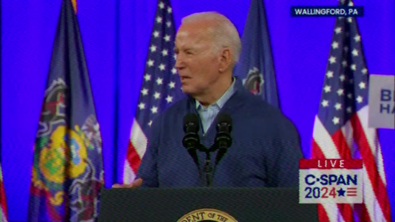 Biden is making stuff up Trump banner with F-U on it and a 6-year-old putting up his middle finger