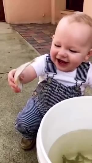 baby likes to play with live fish