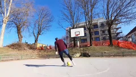 Guy Lands a Rainbow Flick Trick Shot in Basketball Net