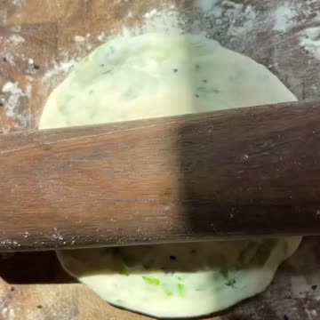 "Flipping Flavors: Delight in the Crispy Goodness of Scallion Pancakes"