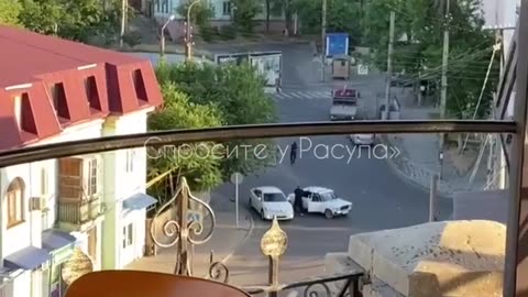 Unknown men in black shooting at police cars.