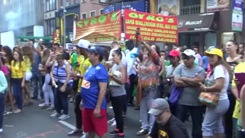 BRAZILIAN GIRL DANCES A BRAZILIAN SAMBA STREET DANCE AT BRAZILIAN CARNIVAL CULTURE PARTY NEW YORK