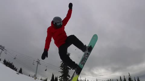 Snowboarder Overshoots The Jump