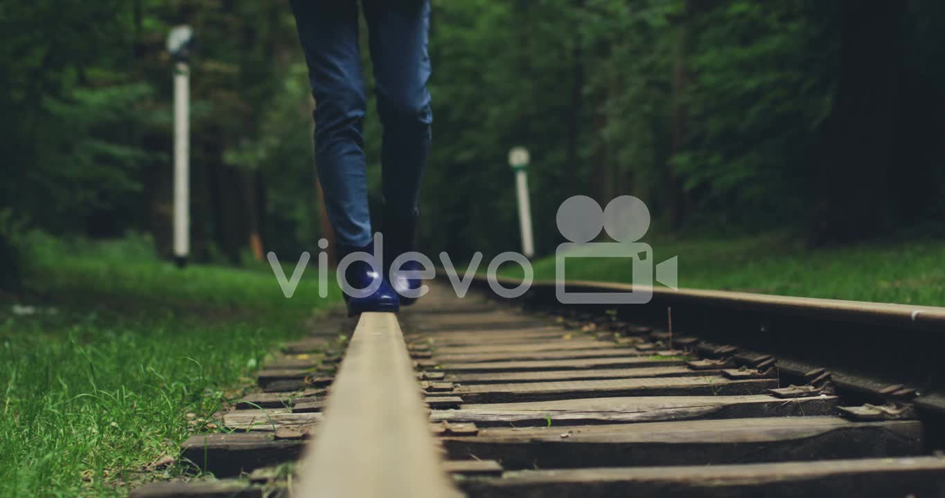 Close Up Of The Female Legs Walking On The Railway