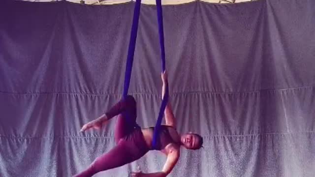 Dancer Shows Different Moves While Spinning During Aerial Silk Practice