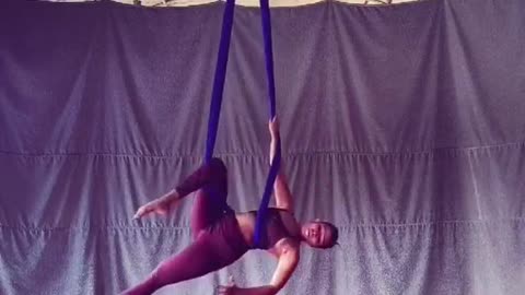 Dancer Shows Different Moves While Spinning During Aerial Silk Practice