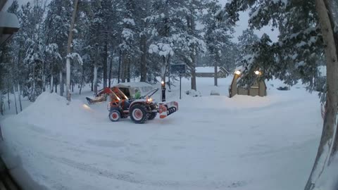 Tractor pushing snow again