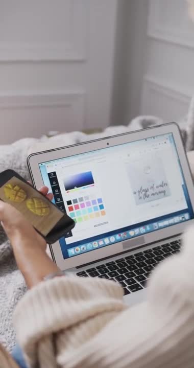 .Woman Using Cellphone while Playing the Dog