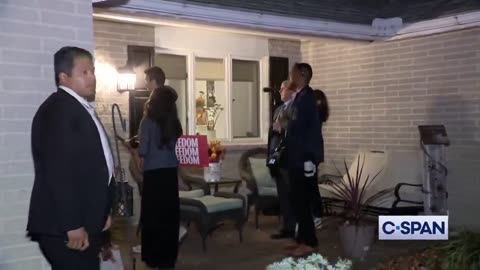 Kamala Harris seen on camera meeting a couple outside their home before