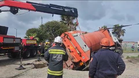 City of Cape Town waste truck stuck in a hole in Lavender Hill