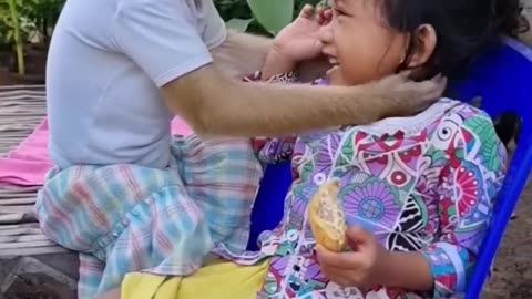 Monkey friendship with girl.