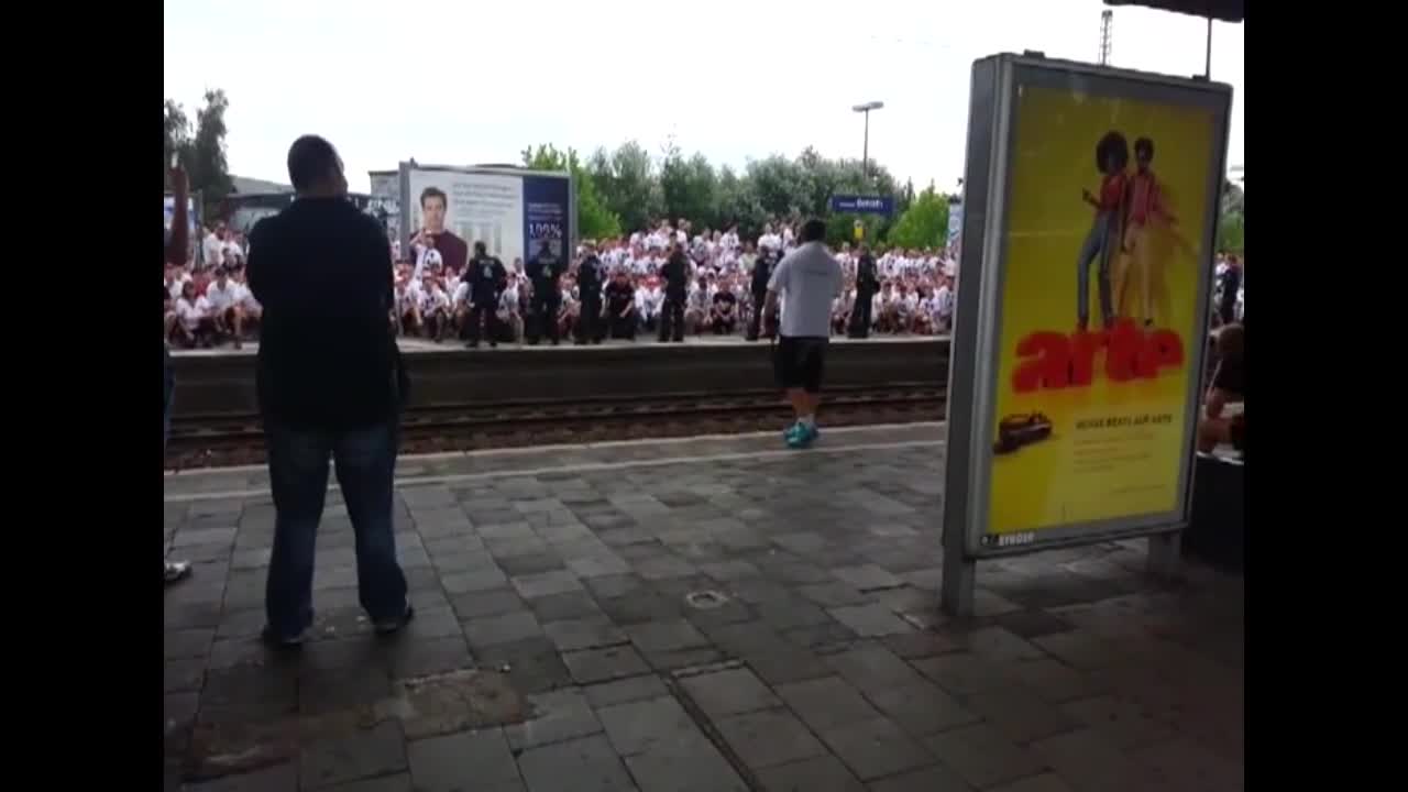 Football fans put on insane show while waiting on train platform