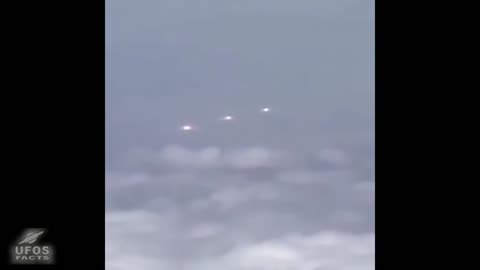 UFOs filmed by an airline passenger.