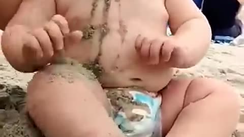 Funny baby reaction on the beach ||