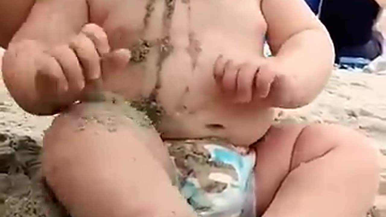 Funny baby reaction on the beach ||