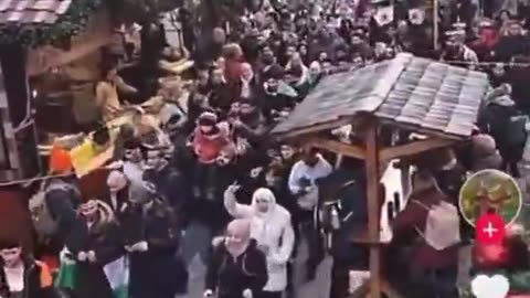 A mob of Islamists march through a German Christmas market.