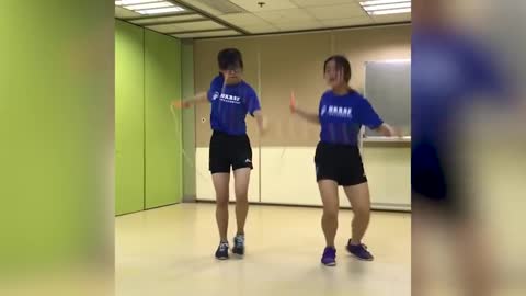 Girls Do Chinese Wheel Jump Rope Trick