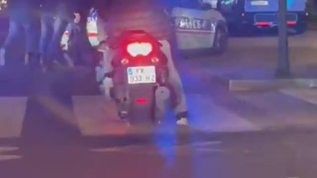 French policemen pushing their car amid fuel shortages in France