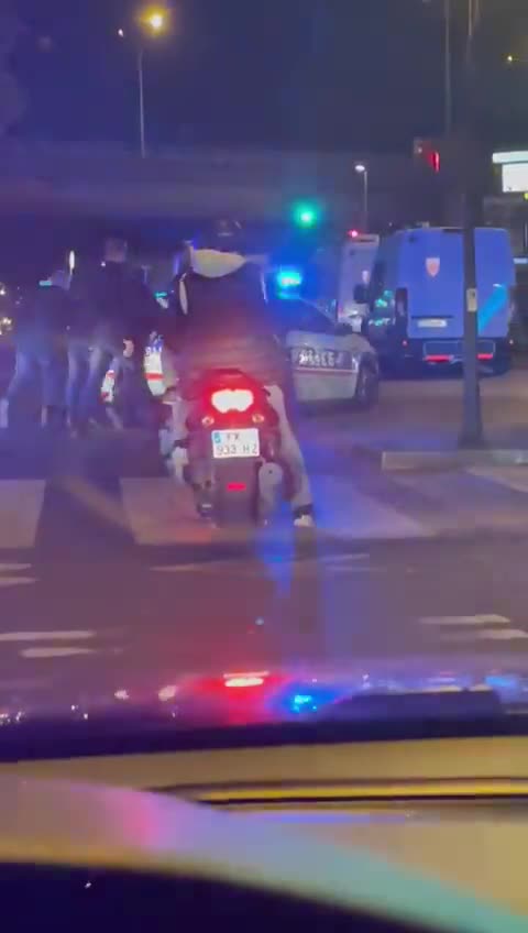 French policemen pushing their car amid fuel shortages in France