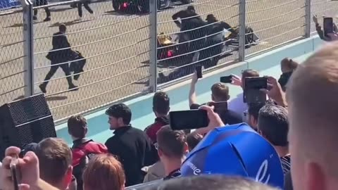 Activist glues his hand to a race track, gets forcefully removed lol 🤣.