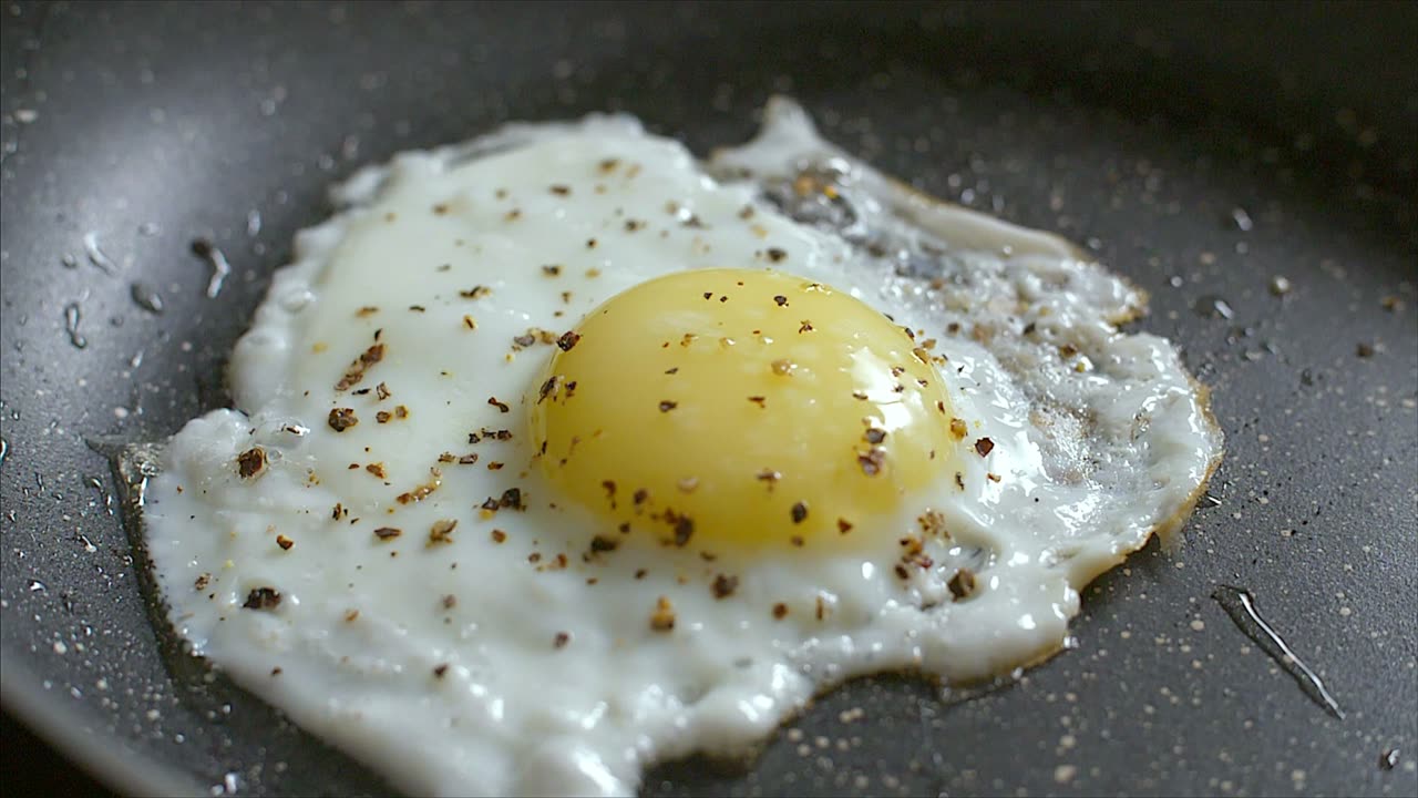 FRIED EGG WITH SPRINKLED BLACK PEPPER