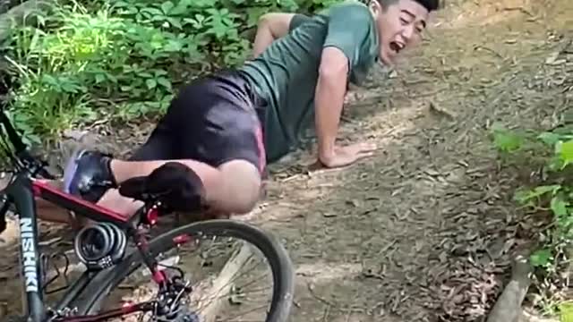 Guy Riding Bike Falls to Ground While Attempting to Jump Over Ditch