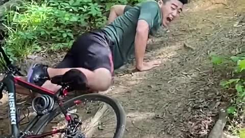 Guy Riding Bike Falls to Ground While Attempting to Jump Over Ditch