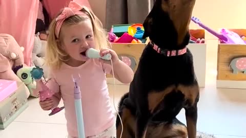 Baby Girl And Her Dog Doing Karaoke