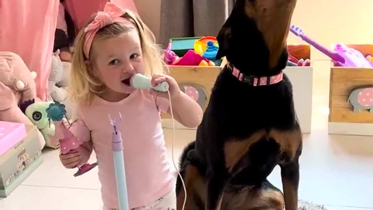 Baby Girl And Her Dog Doing Karaoke