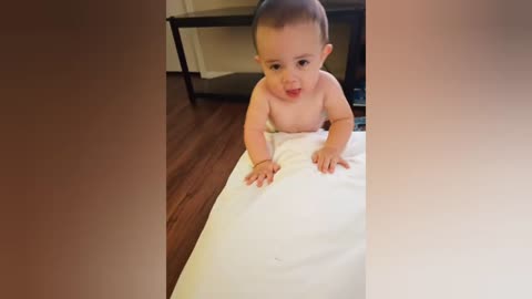 Cute baby boy doesn't want to put on his pajamas 😆