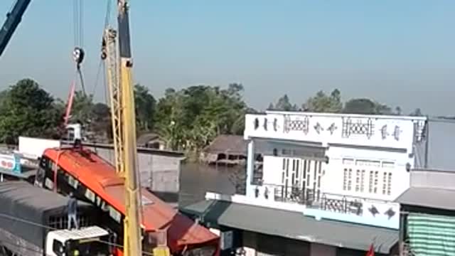 Two large trucks scrambled over a small bridge, and trapped