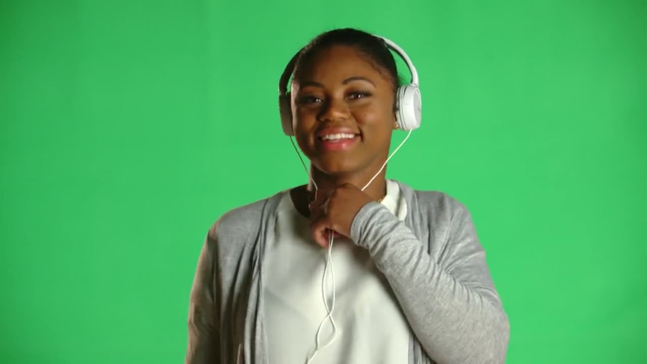 Young African American Woman Headphones Green screen video