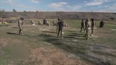 DNR. ABOUT FOOTBALL PLAYS FOOTBALL. POLYGON, GOALKEEPER WITH MACHINE GUNS