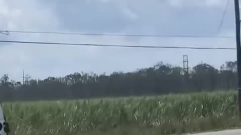 A Zero's Welcome: Louisiana Utility Workers turn back to Biden Motorcade.