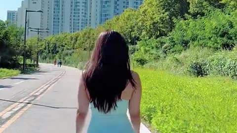 beautiful girl walks with her dog