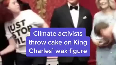 Climate activists throw cake on King Charles' wax figure