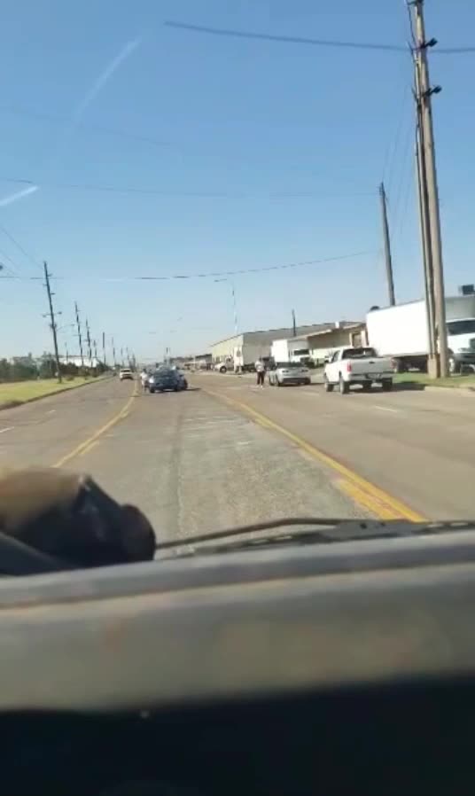 Guy driving catches a shooting live on tape.