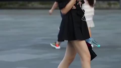 Pretty girl's skirt is too short.