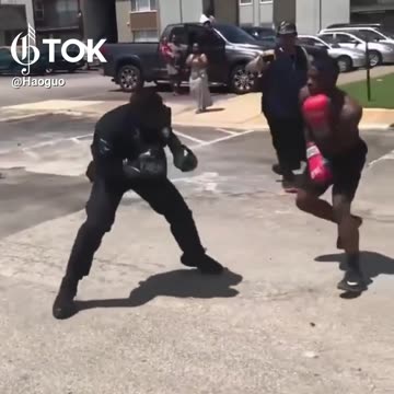 OMG! Policeman fights guy on street! Wow they got skills