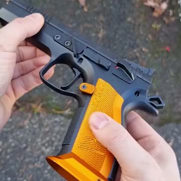 "CZ Orange Pistol 9mm: A Uniquely Colored Handgun with Reliable Performance".