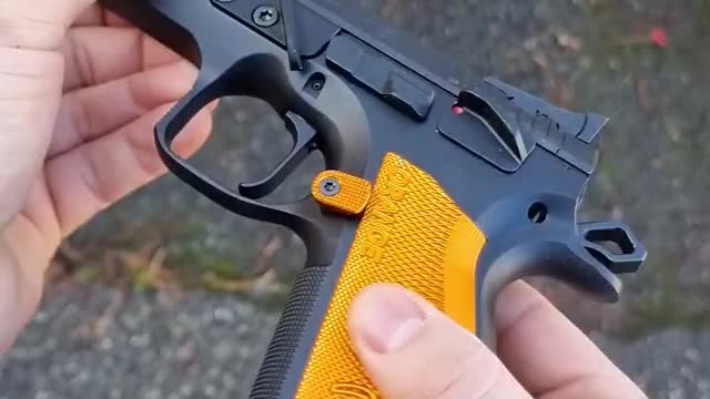 "CZ Orange Pistol 9mm: A Uniquely Colored Handgun with Reliable Performance".