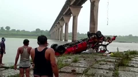 At least 12 killed in India after bus falls into river
