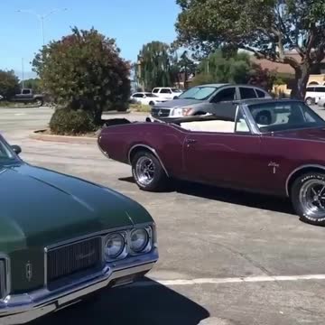old school cutlass in parking lot