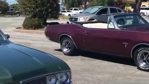 old school cutlass in parking lot