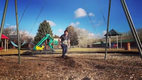 Man Moves Swings And Performs a Frontflip Through It