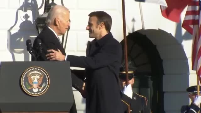 Biden Shakes Emmanuel Macron's Hand for Incredibly Awkward 42 Seconds