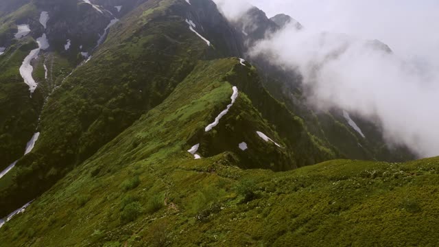 Relaxing Music Plays As Fog Rolls Over A Mountain Trail