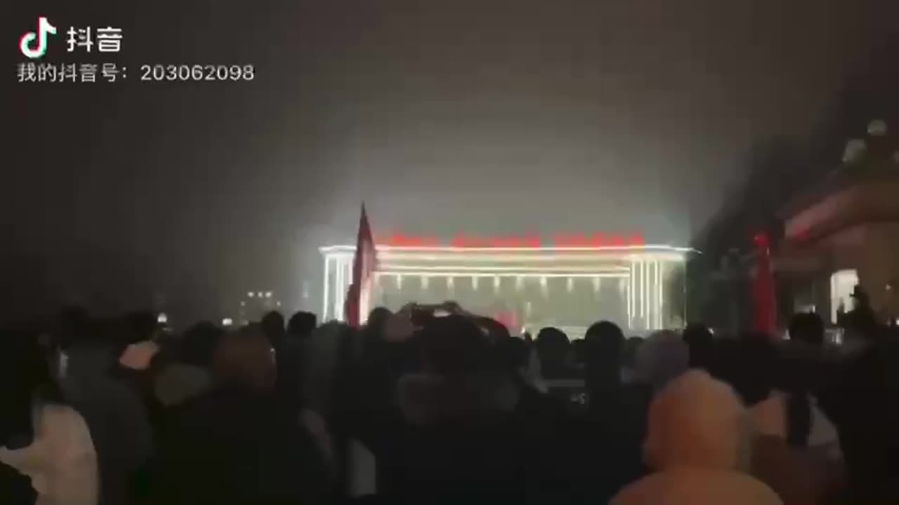 Chinese people marching to the local government building